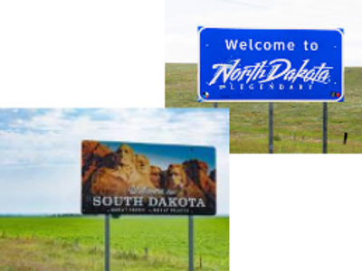 welcome signs for south and north dakota with green field in the background